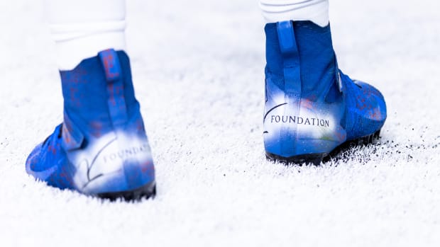 Detroit Lions defensive end Josh Paschal's blue and white cleats.